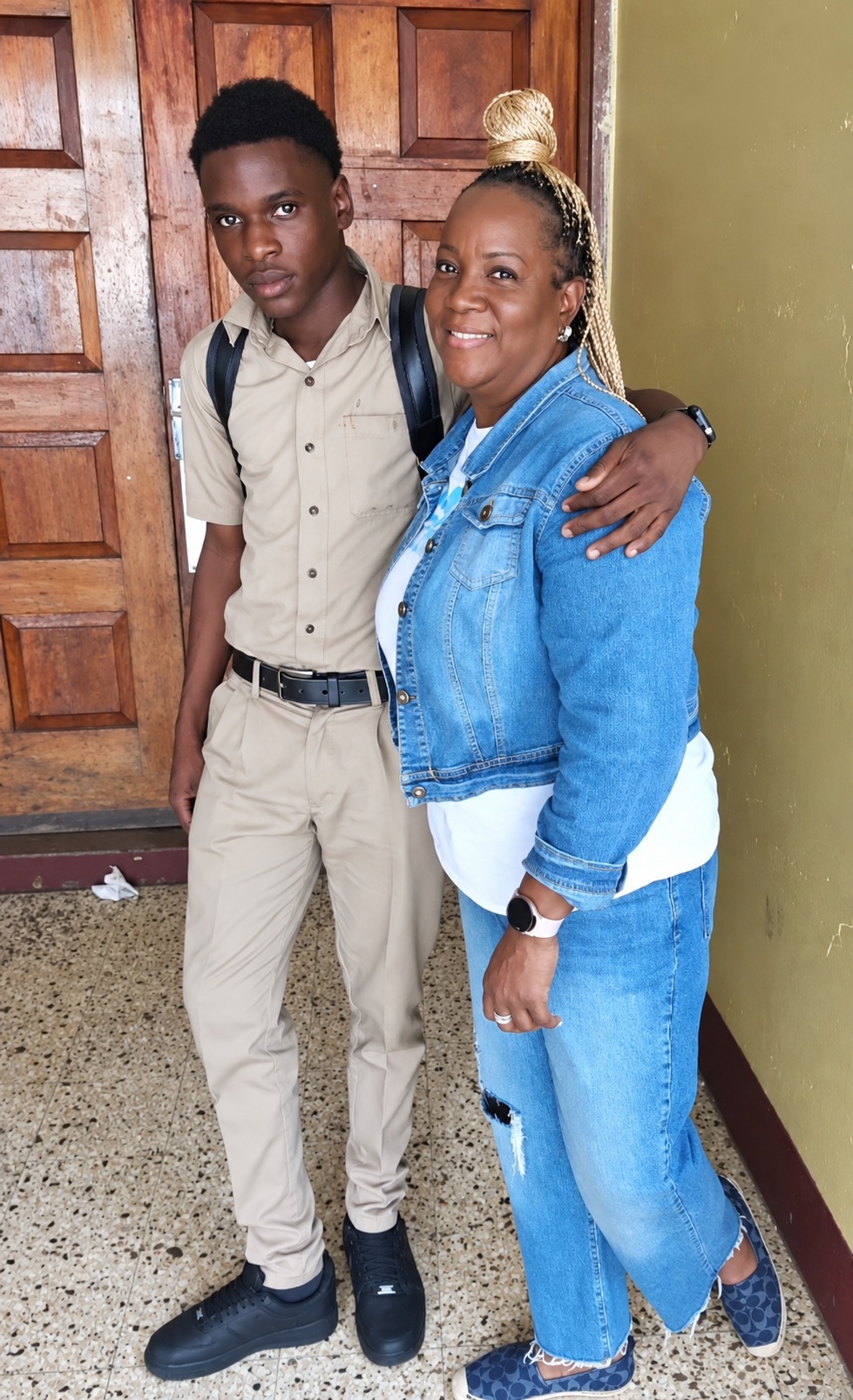Sandra Wright posing with a student at the 2023 conflict resolution workshop in Jamaica